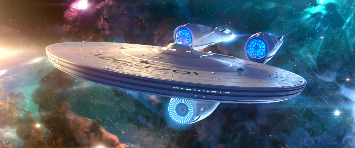 Star Trek Fleet Command official artwork showing a Federation starship in a broad galaxy setting.