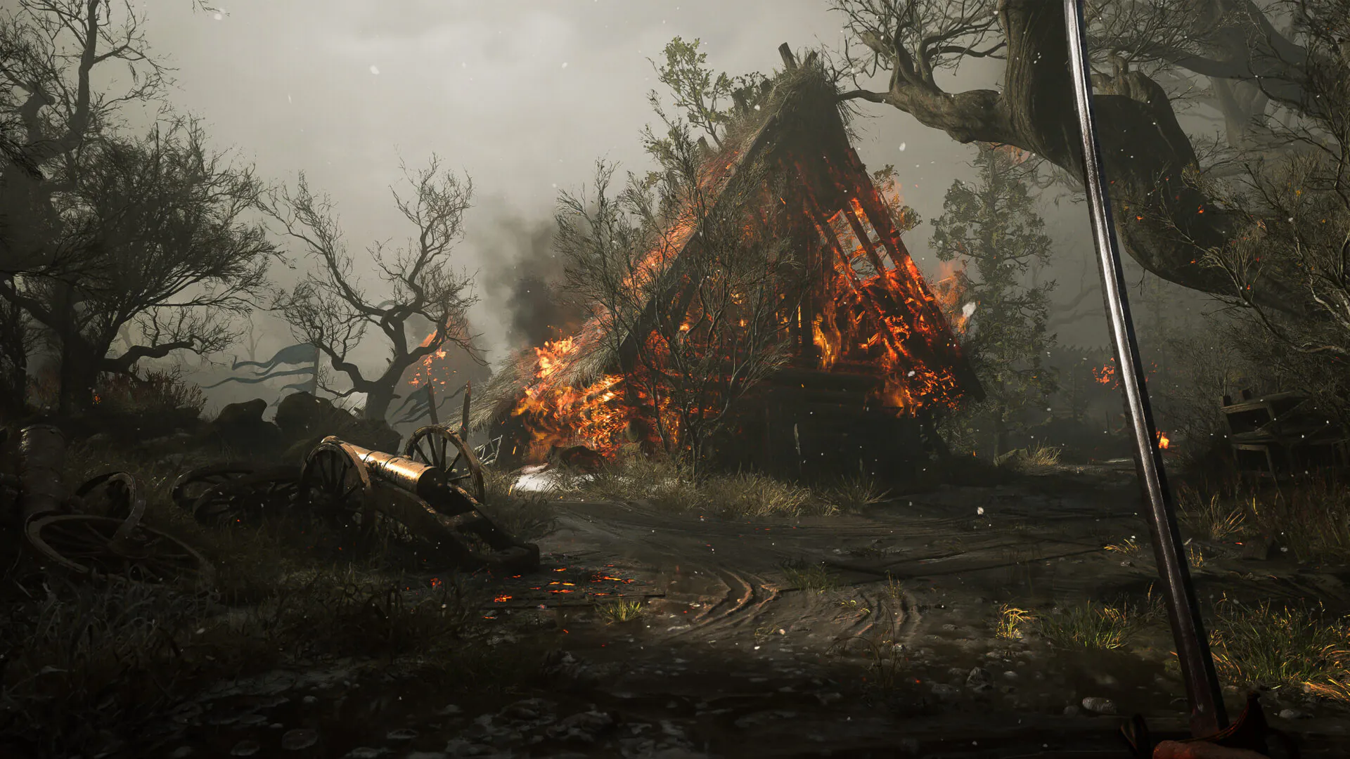 Official Valor Mortis screenshot showing a first-person view of a burning battlefield and a sabre.